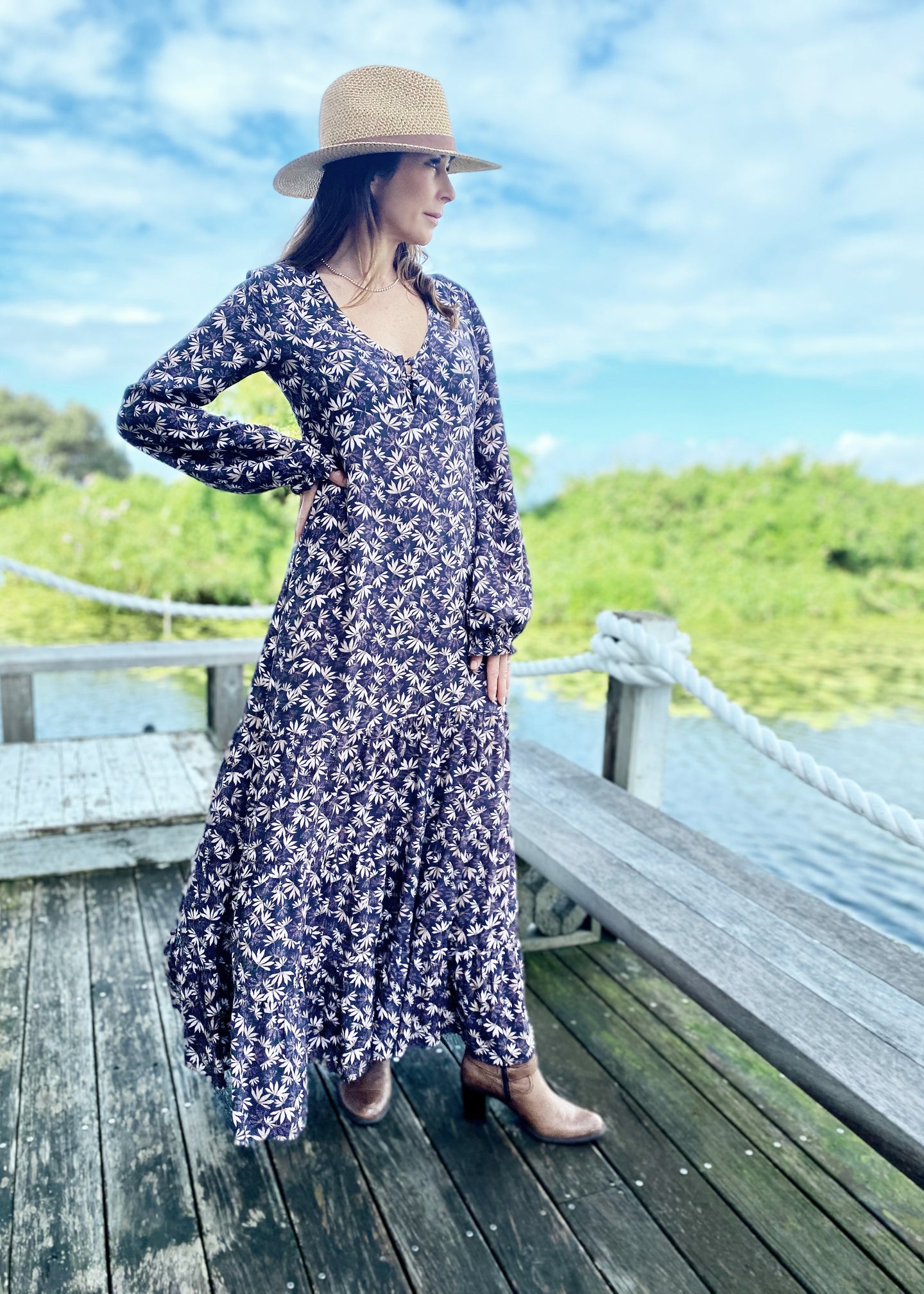 The Elle Maxi is  Perfect for any social occasion, and great for work.  Wih a full skirt and a plunging frill neckline in a beautiful soft pink, beige and aubergine floral print against black.  It features a super flattering design with a v-neck front, empire waist, 3 tiered ruffled hem, a side zip and elegant bell sleeves.  In a gorgeous soft Rayon, it is breast-feeding friendly with buttons at the front and is super quick and easy
