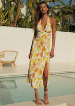Load image into Gallery viewer, The Zola Halter Dress is a stunning, elegant dress in a beautiful Citrus floral print Rayon.  It features a super flattering midi length with a slit on one side, halterneck, and lovely folds around the fitted waist.  A fruity little number in a zesty citrus print that is sure to have heads turning.  Fully lined with an invisible zipper in the side seam and elasticated back.
