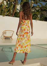 Load image into Gallery viewer, The Zola Halter Dress is a stunning, elegant dress in a beautiful Citrus floral print Rayon.  It features a super flattering midi length with a slit on one side, halterneck, and lovely folds around the fitted waist.  A fruity little number in a zesty citrus print that is sure to have heads turning.  Fully lined with an invisible zipper in the side seam and elasticated back.
