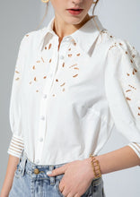 Load image into Gallery viewer, Simplicity in white! The stunning Latizia blouse by GDS comes with a fine cotton construction and embroidered detail on the sleeves and front.  The cut outs are trimmed in a soft cream cotton giving the blouse a lovely vintage tone.  Beautifully made, the 3/4 length sleeves are slightly puffed with a lovely embroidery detail and finished with exquisitely detailed cuffs, which are also buttoned.  
