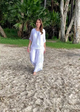 Load and play video in Gallery viewer, The Polly Pocket Pants are a gorgeous bohemian silk pant made from an Italian silk blend, by Jenny Jazz.   With plenty of volume in the legs, these pants float with every move and feature gathered silk pockets on the sides, and a soft comfortable cotton lining.  The thick, jersey waistband provides effortless comfort.  For a flattering Bohemian lux look, wear with the Primadonna Feather Singlet, and Jacket, or the Summer Lace Top, they will quickly become a favourite for more than just one season!  
