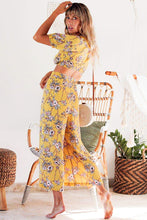 Load image into Gallery viewer, Our Bonni Pants are the cutest addition to your summer wardrobe, a total ray of sunshine, made for days with endless blue skies.  These high-waisted, wide legs pants in a bright yellow floral print with a zip enclosure at the back and 2 soft pleats at the front.  Full of summer sunshine and utterly flattering, these culotte style pants will take you from the beach during the day to a wine bar at night. 
