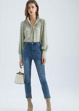Load image into Gallery viewer, The stunning Isla Pleated blouse, beautifully made with cuffed full length sleeves, a frill neck and statement gold buttons down the front.  An abstract graphic design adorns this blouse with pleats and delicate gold elements add to the wow factor of this design.  Pair with jeans, or with tailored trousers or skirt for a more formal look.  For women who want to look elegant and effortlessly stylish from desk to dinner. 
