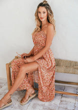Load image into Gallery viewer, pretty floral print of the Barossa Dress in soft earthy colours of camel, pink and peach.  With a shirred waist and above the bust, and delicate ruffle detail on the tiered skirt, this dress will accommodate many bust sizes with no zips or critical fits.  Lightweight Rayon is cool and flowy, with a split at the front and adjustable straps
