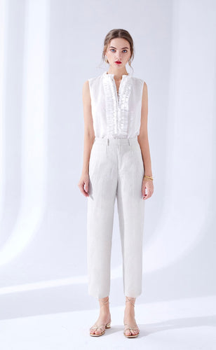 Made from a luxurious soft linen, the Rabanne Linen Pants are a beautiful blend of effortless style with a modern edge.  A more tailored look in a fine quality linen fabric, they have a straight cropped leg, with a flat front and side pockets.  Crisp and structured, with a stitched front seam, these versatile pants will take you from the office during the day to a 5 star restaurant at night, or to a sophisticated garden party at the weekend.  These are a more relaxed fit,