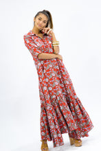 Load image into Gallery viewer, The Skye Maxi shirt dress is a gorgeous full length maxi dress, featuring a wide tiered section at the hem and side slits either side.  With a stylish shirt collar, buttoned to the chest with a seam under the bust and 3/4 cuffed sleeves. The skirt has generous volume with so much fabric, which is soft and floaty in a gorgeous red floral print.  Can be worn belted or loose with pockets
