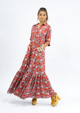Load image into Gallery viewer, The Skye Maxi shirt dress is a gorgeous full length maxi dress, featuring a wide tiered section at the hem and side slits either side.  With a stylish shirt collar, buttoned to the chest with a seam under the bust and 3/4 cuffed sleeves. The skirt has generous volume with so much fabric, which is soft and floaty in a gorgeous red floral print.  Can be worn belted or loose with pockets
