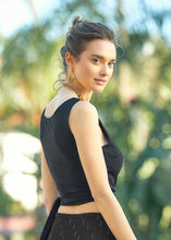 Load image into Gallery viewer, The Sleeveless Wrap Crop Top in a crisp black Viscose fabric.   A deep V neck and cross over at the front which ties up at the side or back. A simple, yet elegant easy to wear top that is lightweight and cool, and pairs well with shorts, jeans, trousers or a skirt.  A great go-to summer top
