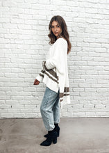 Load image into Gallery viewer, The Layla Slouch Jumper by Bagira is a stunning oversized knitted jumper in a gorgeous cream and caramel cotton blend. The casual slouch style is both sassy and classy at once with some seams reversed giving this jumper a trendy street cred.  With wide sleeves and extra long panels at the back, it is casual and feminine and looks fabulous paired with jeans, leather pants, leggings, or a mini and high boots
