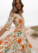 Load image into Gallery viewer, The beautiful Ravello floral print Isla Maxi Dress by Caro The Label.  The gorgeous print in autumnal colour palette represent the colours of Australian flowers!  The long loose flowing skirt skims the body flattering the figure.
