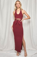 Load image into Gallery viewer, A stunning halter neck skirt and top set in a cotton/spandex stretch fabric. Slim fitting to show off all your curves, the Maxi length skirt has a slide split and a high waistband to flatter the silhouette.  The halter neck top has a tie front detail and V neckline, and offers good support.  In a gorgeous earthy plumb colour this design is very flattering and sure to turn heads.  The cotton/spandex feels comfortable and supportive.
