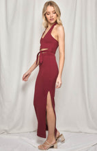 Load image into Gallery viewer, A stunning halter neck skirt and top set in a cotton/spandex stretch fabric. Slim fitting to show off all your curves, the Maxi length skirt has a slide split and a high waistband to flatter the silhouette.  The halter neck top has a tie front detail and V neckline, and offers good support.  In a gorgeous earthy plumb colour this design is very flattering and sure to turn heads.  The cotton/spandex feels comfortable and supportive.
