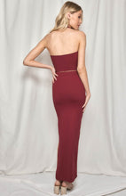 Load image into Gallery viewer, A stunning halter neck skirt and top set in a cotton/spandex stretch fabric. Slim fitting to show off all your curves, the Maxi length skirt has a slide split and a high waistband to flatter the silhouette.  The halter neck top has a tie front detail and V neckline, and offers good support.  In a gorgeous earthy plumb colour this design is very flattering and sure to turn heads.  The cotton/spandex feels comfortable and supportive.
